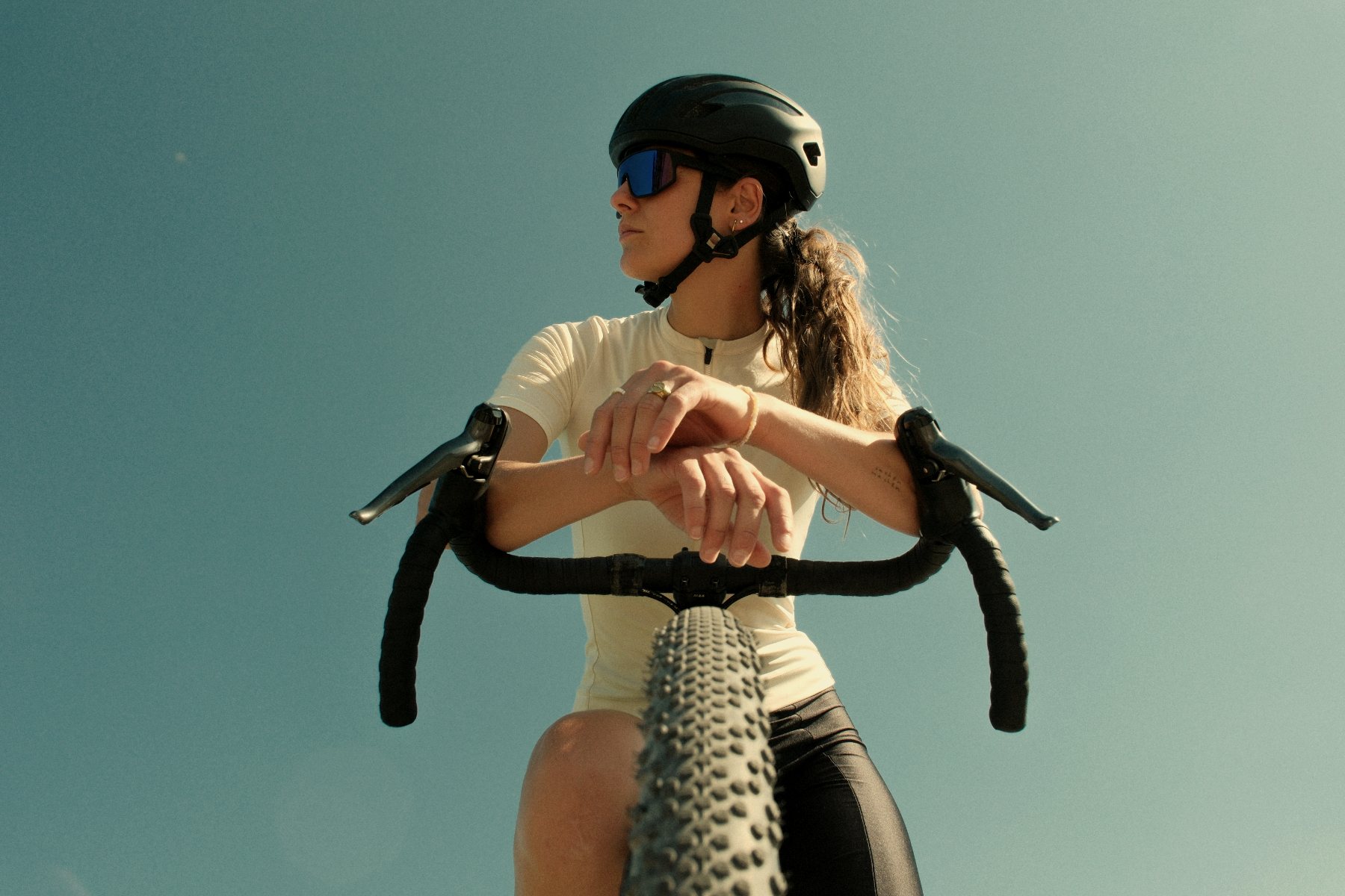 Cyclist resting on handlebars